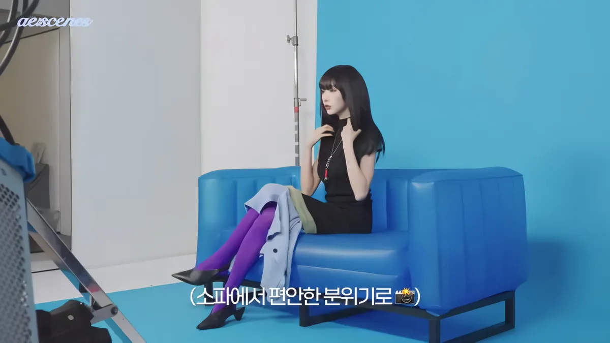 aespa Giselle poses on a blue sofa during SuperELLE China photoshoot