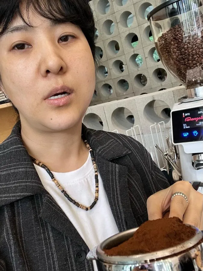 Comedian Kang Yu-mi Poses as a Barista in Front of an Espresso Machine
